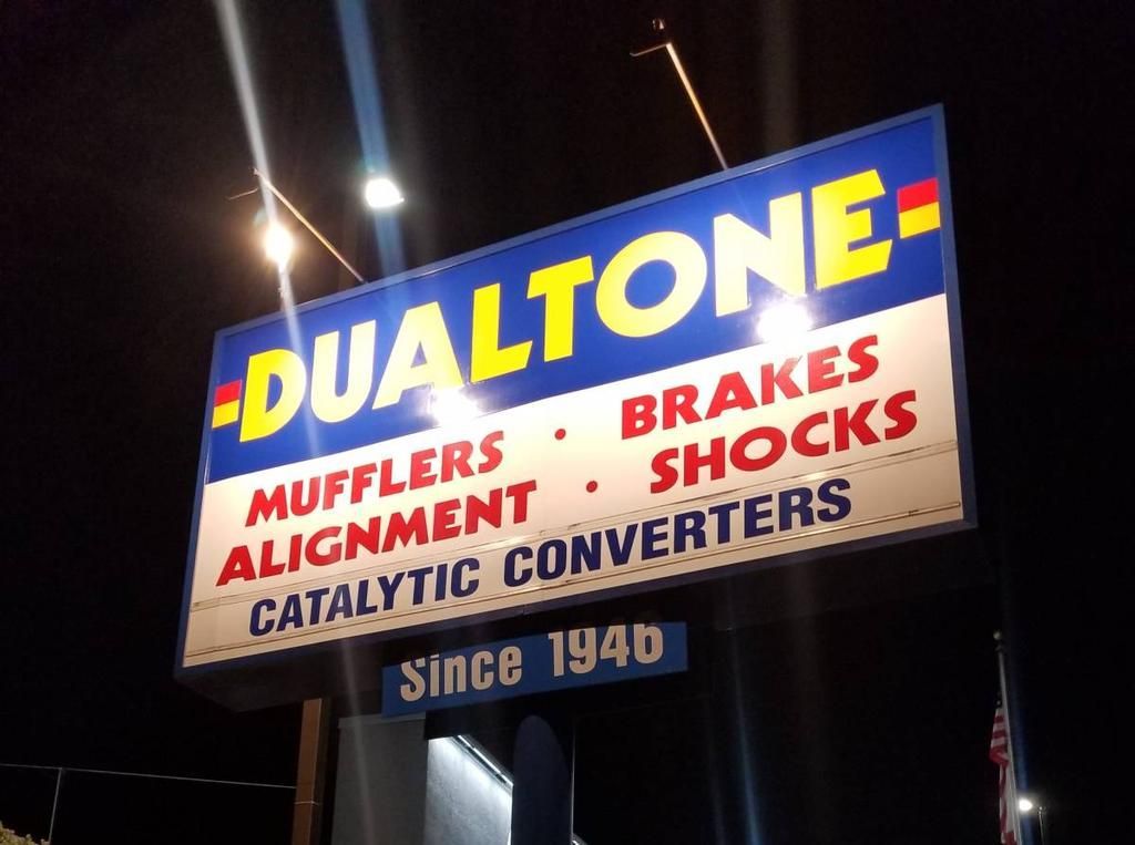 Dualtone 'Since 1946' sign lit at night
