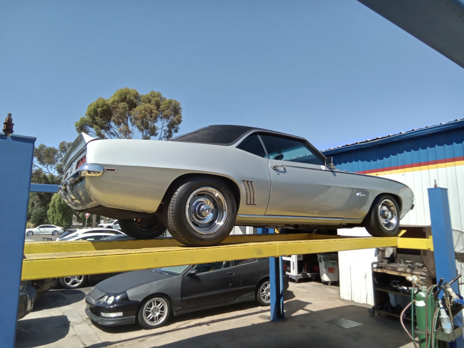 Classic car on a lift in the Dualtone shop